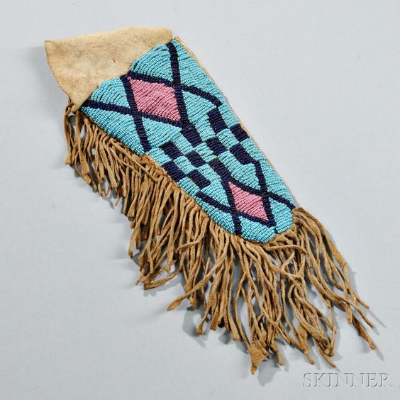 knife sheath geometric pattern and fringes on a gray background