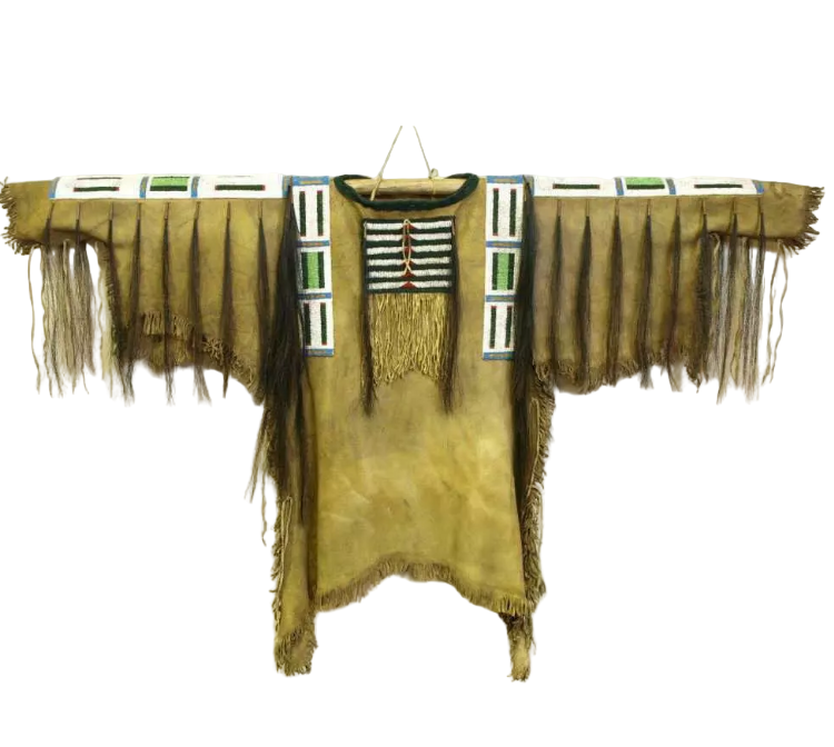 Traditional Native American garment with fringes and beadwork on a white background