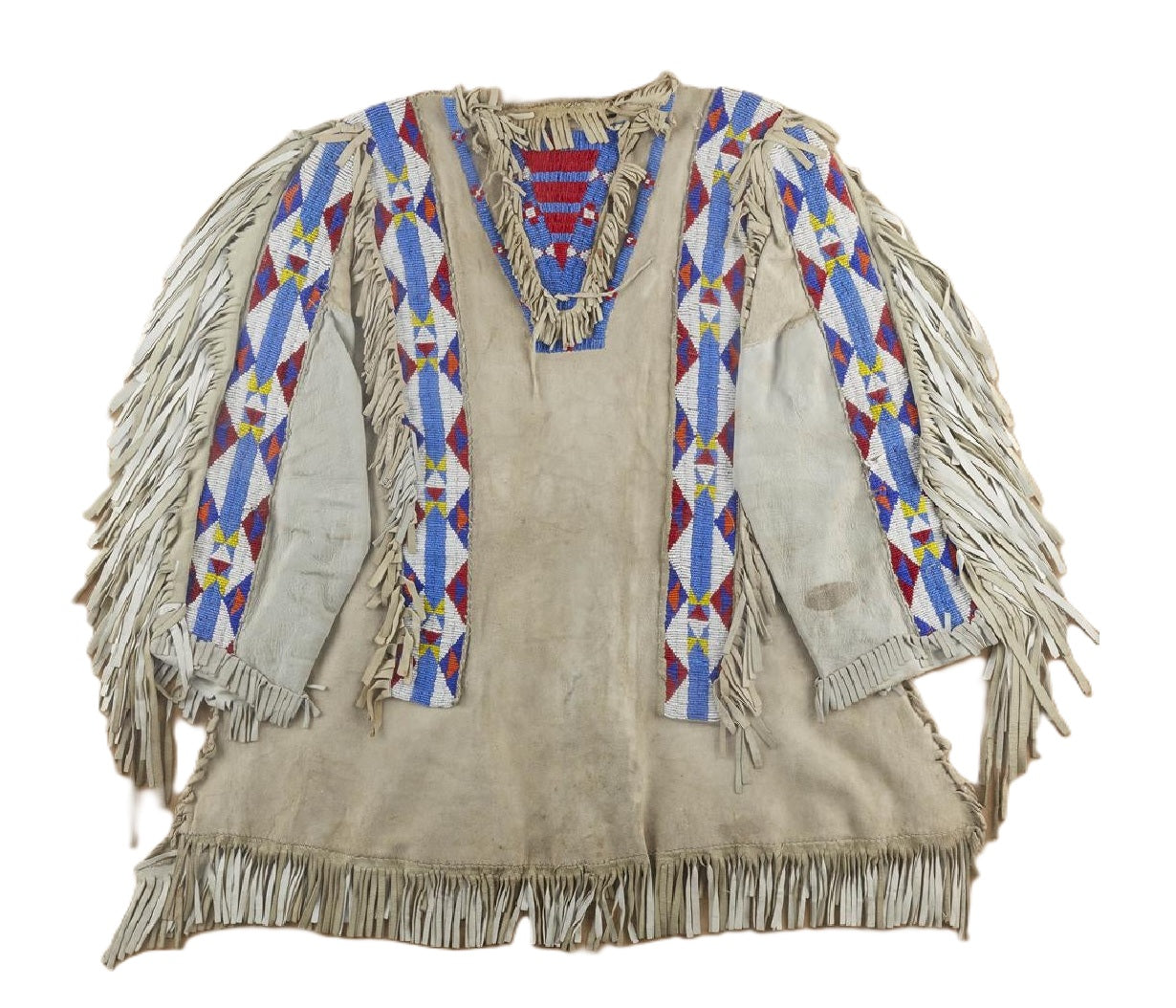Traditional Native American garment with fringes and colorful patterns on a white background