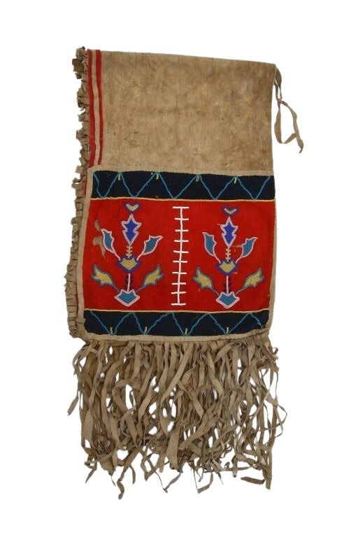 Traditional Native American Saddle bag with intricate patterns and fringes on a white background