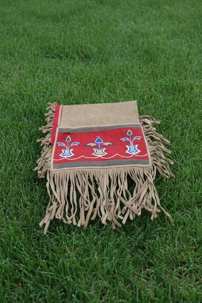 Decorative mat with fringe on grass