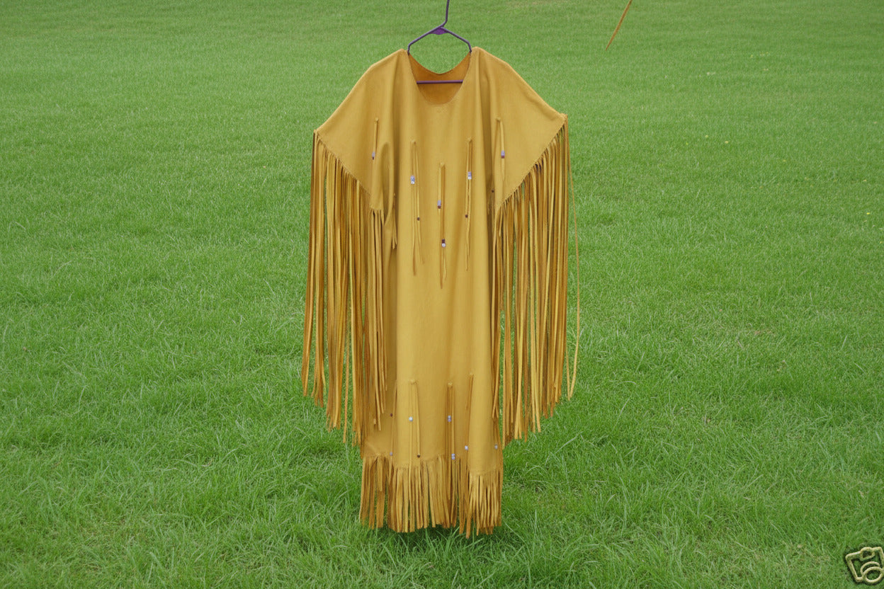 Yellow fringe garment on a hanger against a natural background