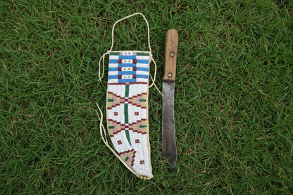 Beaded knife sheath on a white background