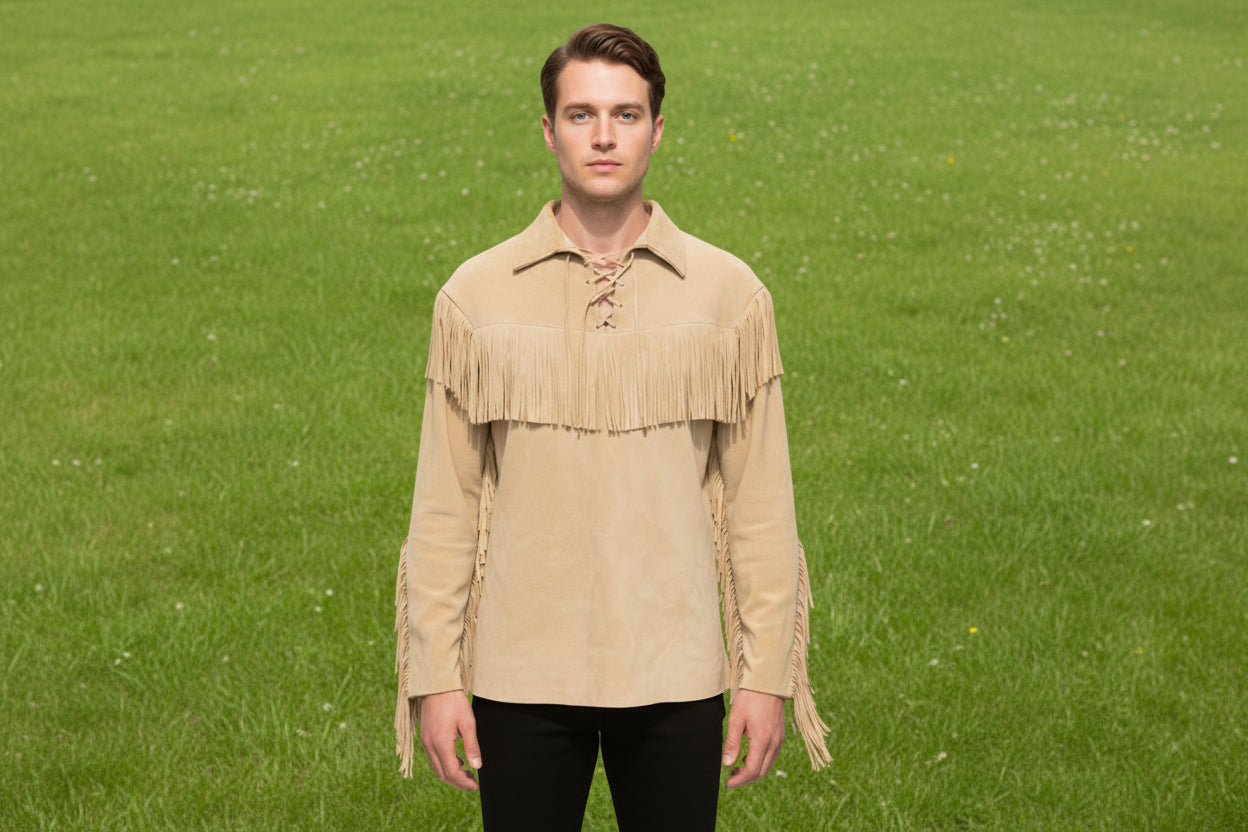 Man wearing a beige suede shirt with fringe details on a white background