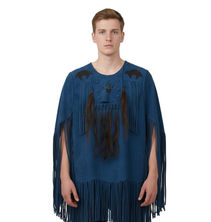 Man wearing a blue fringe garment on a white background