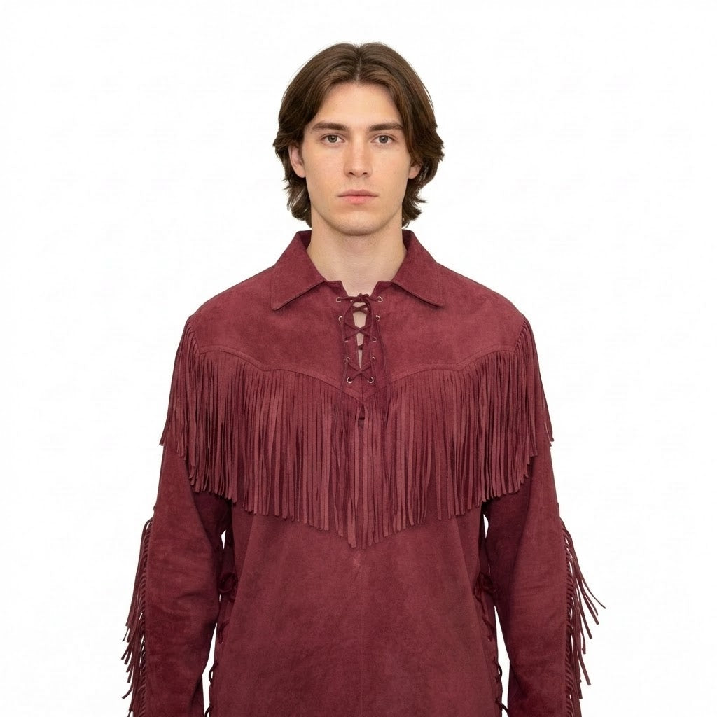 Man wearing a maroon suede shirt with fringes on a white background