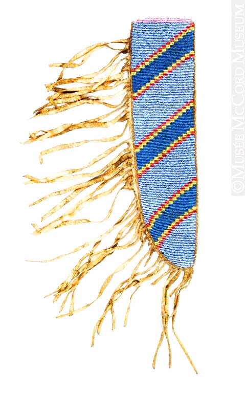 Decorative knife sheath with blue and gold fringes on a white background
