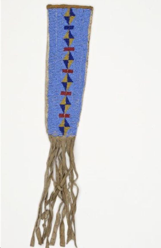 Decorative knife sheath with blue bead pattern and brown root-like base on a white background