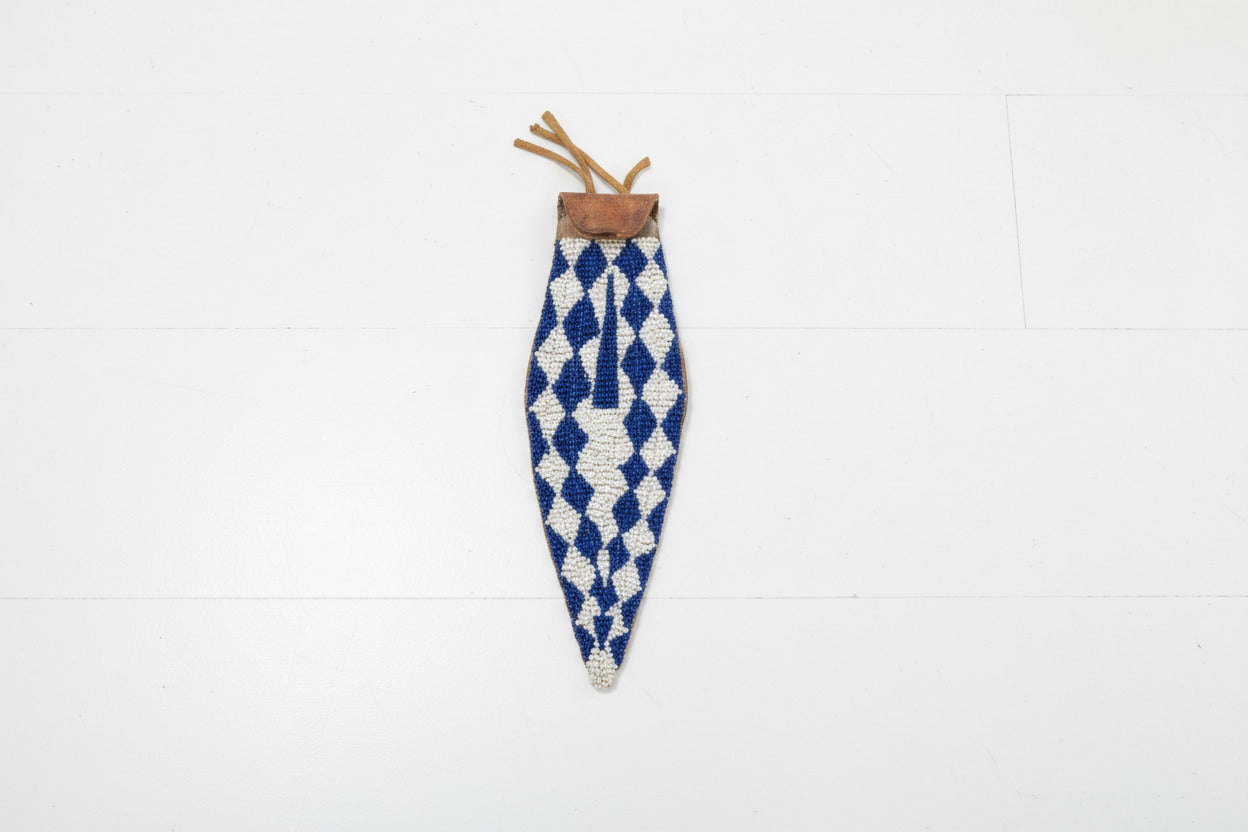 Decorative sheath with blue and white pattern on a gray background