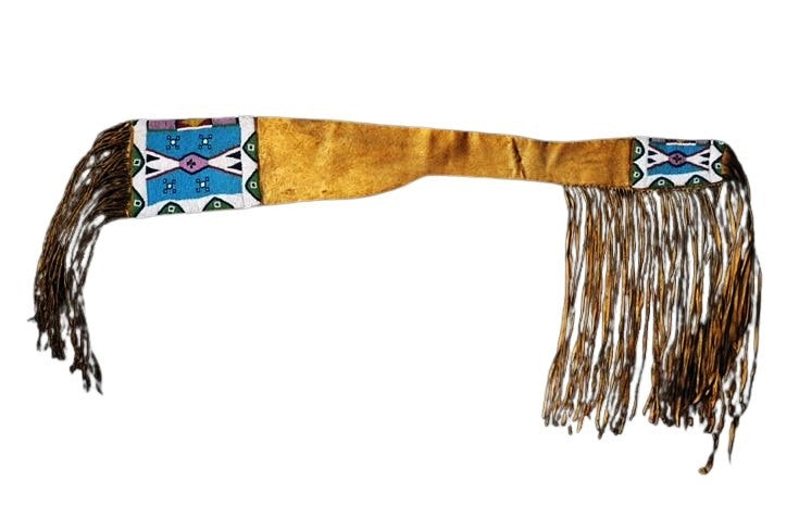 Decorative Native American sheath with fringes on a white background