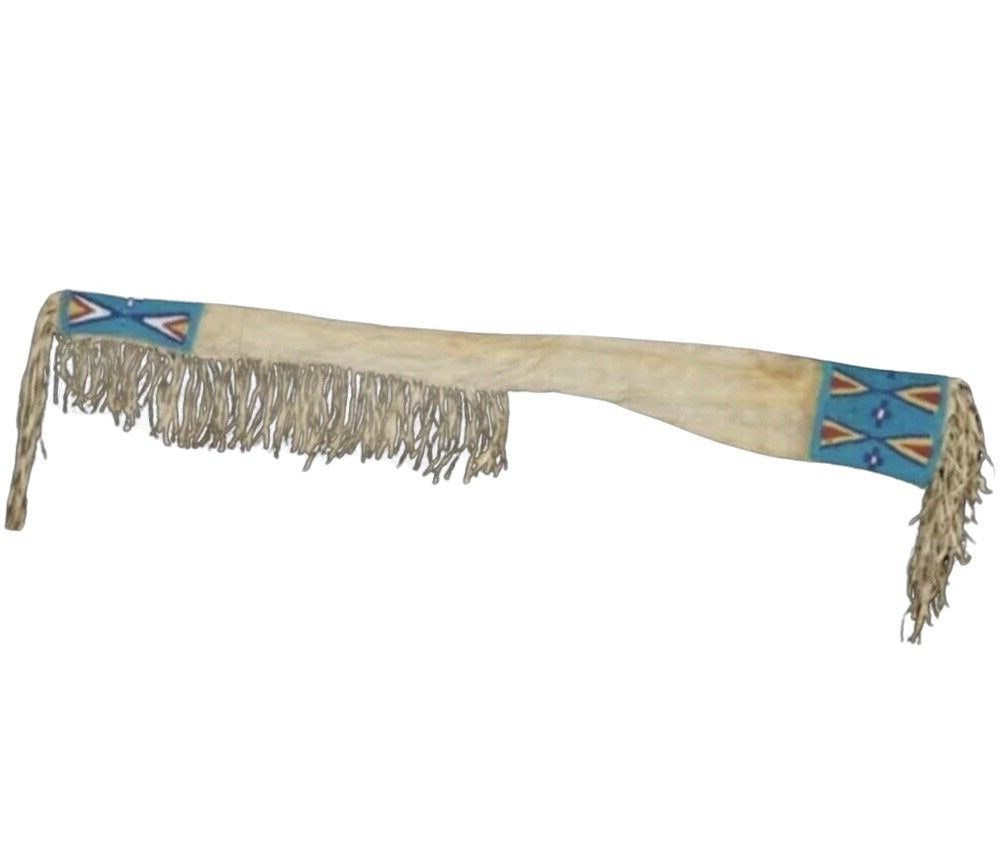 Decorative sheath with fringe and geometric patterns on a white background