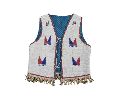 Traditional beaded vest with fringe on a white background