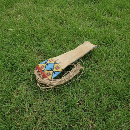 Decorative Pipe Bag with colorful pattern on grass