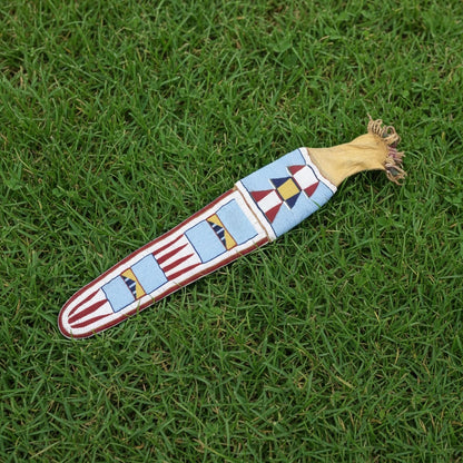 Decorative Pipe Bag with geometric pattern on grass