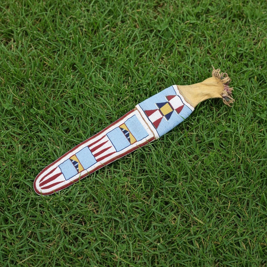 Decorative Pipe Bag with geometric pattern on grass