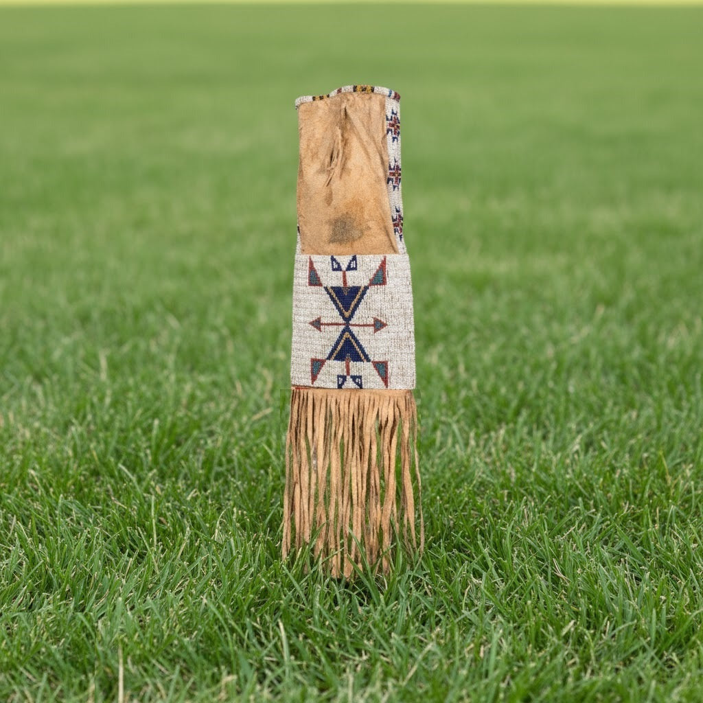 Decorative bag with fringe and pattern on grass