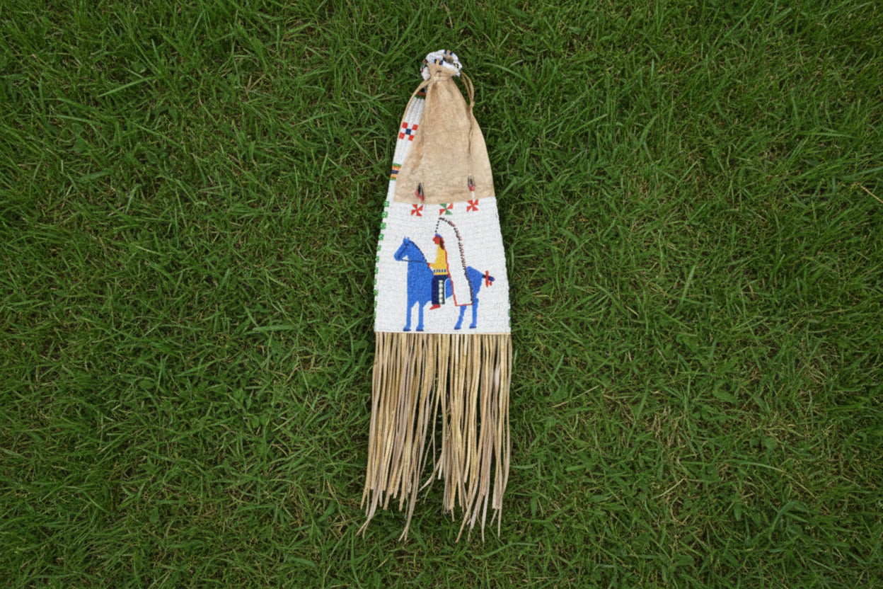 Decorative horse beaded bag with colorful patterns and fringes on a white background