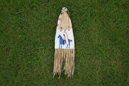 Decorative horse beaded bag with colorful patterns and fringes on a white background