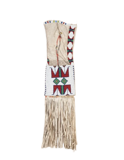 Decorative bag with geometric patterns and fringes on a white background