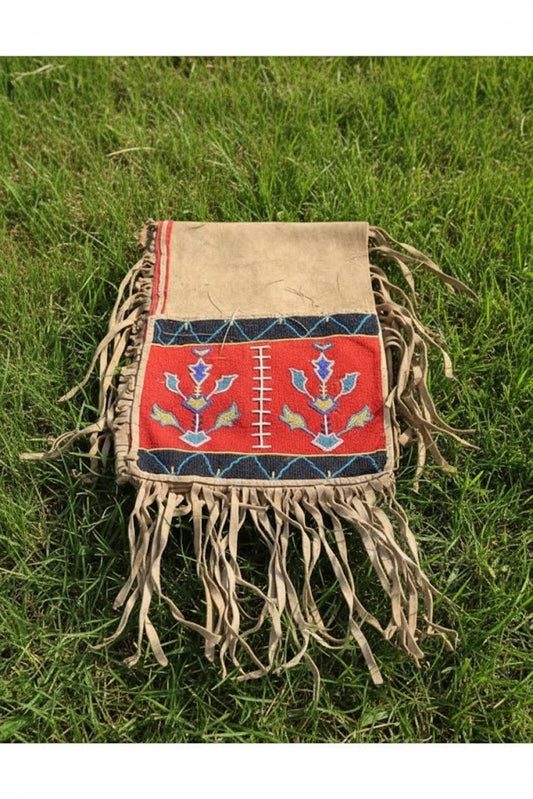 Traditional  bag with fringe on grass