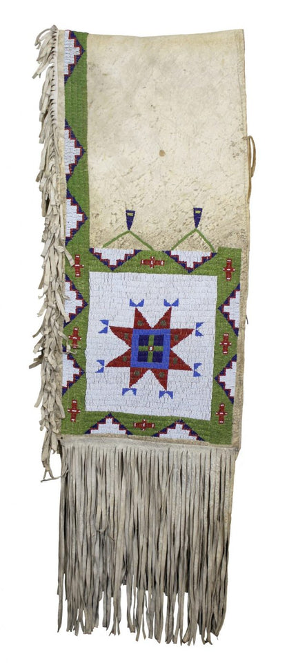 Decorative saddle bag with geometric patterns and fringes on a white background