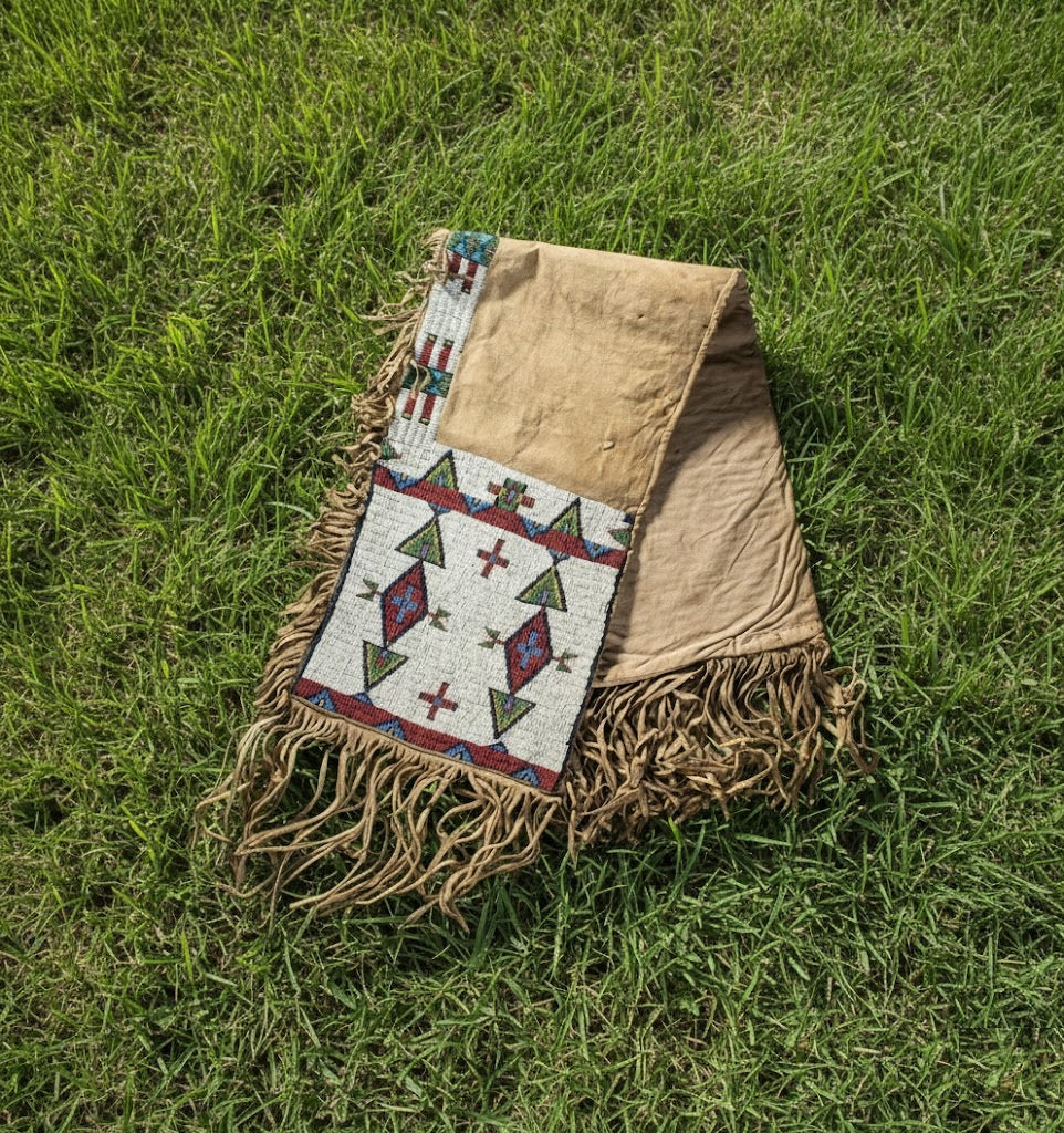 Textile with geometric patterns and fringes on grass