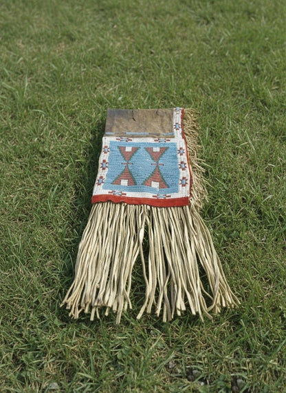 Traditional Bag with fringes on a grassy background