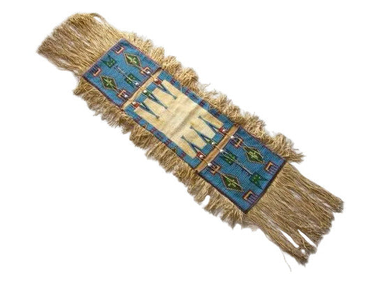Decorative saddle bag with a blue and gold pattern on a white background