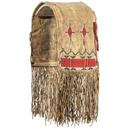 Traditional Native American saddle bag with intricate beadwork and fringes on a white background