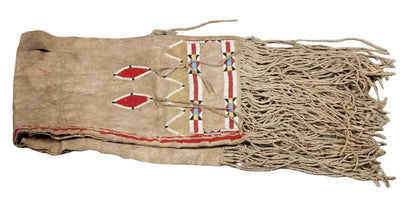 Native American-style saddle bag with fringes and geometric patterns on a white background