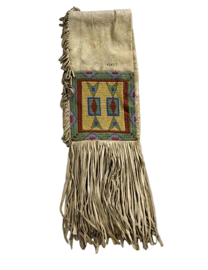 saddle bag with geometric pattern and fringes on a white background