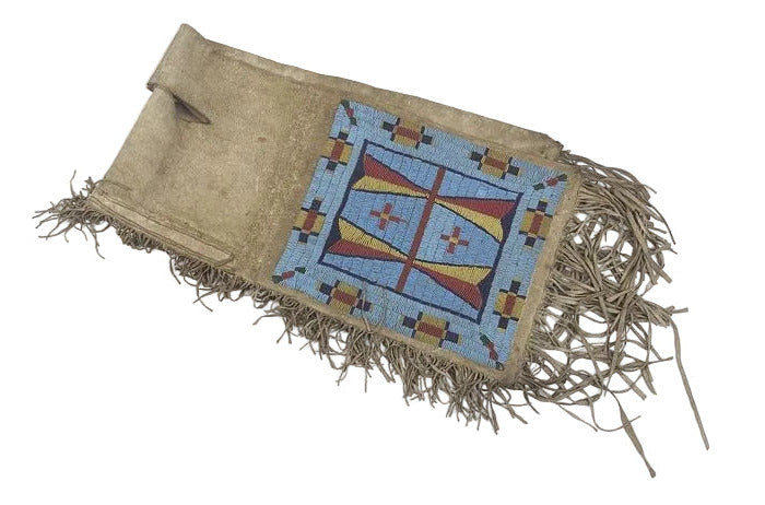 saddle bag with geometric pattern and fringes on a white background
