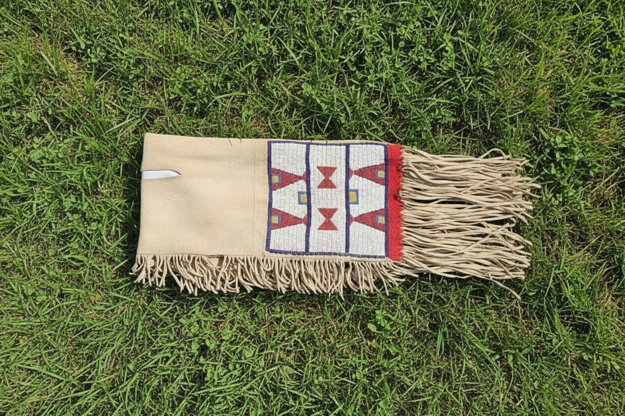 Textile with geometric patterns and fringes on grass