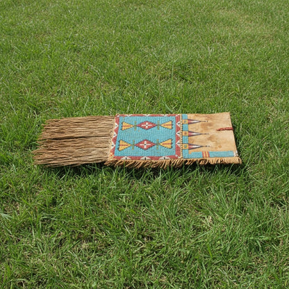 Traditional Saddle Bag with decorative design on grass
