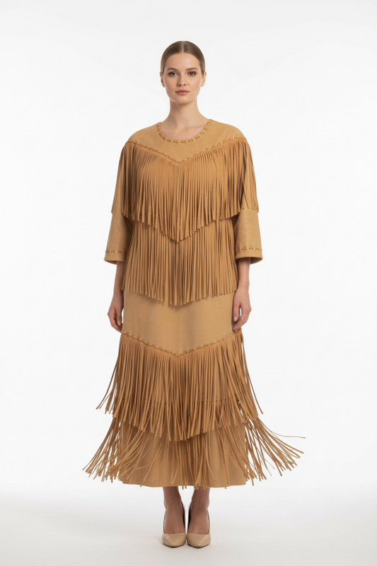 Vintage-style dress with fringes on a mannequin against a white background