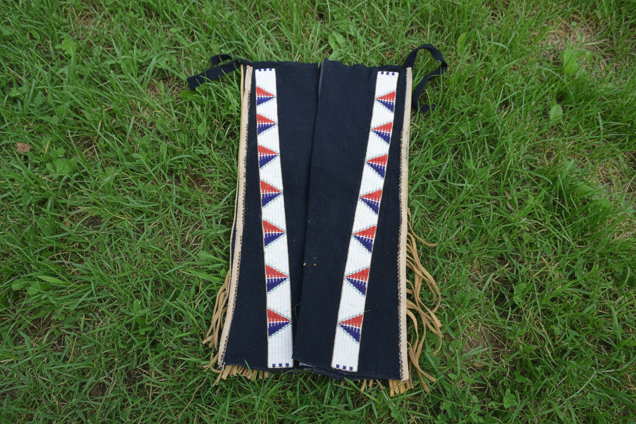 Black fabric with a colorful geometric pattern on a white background