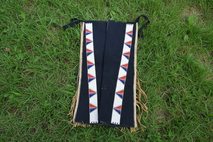 Black fabric with a colorful geometric pattern on a white background