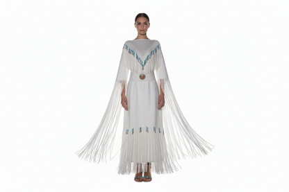 Long dress with fringe and bead details on a mannequin against a white background